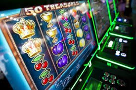 Treasures Aztec game reels on dinar33 login showing Aztec symbols, balance display, and spin button